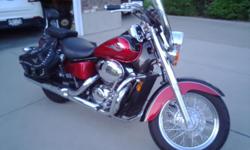 motorcycle is red and black paint with,windsheild, saddle bags,sissy bar w/pad, highway pegs. it is in&nbsp;A&nbsp; one condition has always been in garage. it has 18,500 miles approximately and most of the miles are highway miles. it has new