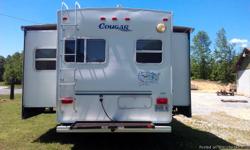 2003 Keystone Cougar 5th wheel camper: Has 2 slides, rear kitchen, large basement storage, rear carryall, electric front jacks, diamond plate rock guard, 2 tv's, very good condition! Asking $13,000.00.. 423-637-5731 Call or text Gerald
