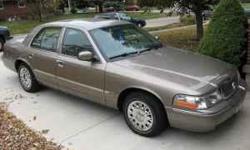 The proverbial little old ladies car! Nearly new Grand Marquis with 23,200 original miles. Metalic gold with beige cloth interior. 4.6 liter V8, automatic, power everything, adjustable pedals,traction control, keyless entry, CD/cassette. One owner,
