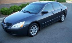 This is a one owner Carfax certified 2004 Honda Accord EX V6 four door sedan with factory navigation and has only 66K low miles! Comes in dark charcoal metallic with gray leather interior. This Accord looks and drives great and is fully loaded with all