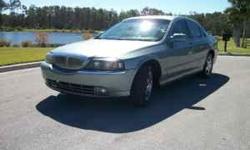 This 2004 Lincoln LS is a 4 door sedan with a 3.0L V6 and an automatic transmission. The car is blue with tan leather interior and has 88K miles. The car features AM/FM/CD audio, 60/40 split folding rear seats, tilt and telescoping steering wheel with