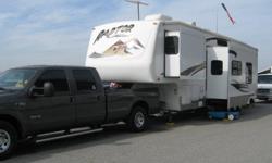 2004 Raptor 5th Wheel Toy Hauler with luxury living quarters separated from the 12ft garage. This RV is in excellent condition with very few miles on the generator. It sleeps 8 with a dinette, couch and upstairs bedroom. Very roomy with its two slide outs