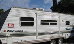 Wildwood Lite by Forest River. 22 1/2 ft. sleeps 6, pop-out side, tub/shower. Two doors. Like new! 951-688-3305