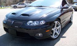 2005 Pontiac GTO
This pristine Muscle car is privately owned and only has 25K miles on her. The owner has upgraded the wheels to premium 19? wheels and Tires and has added the Ram Air hood.
This GTO is the Phantom Metallic Black with factory tinted