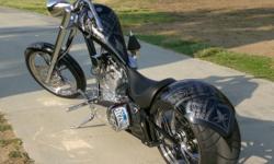 2005 Big Bear Chopper is in immaculate condition. 3,500 Miles. This is the sled 300 chopper with the 300mm rear tire. This bike was painted by a well known painter in Riverside, CA who is known for painting with the bandana print. This type of paint job