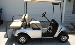 2005 EZ-GO Golf Cart,..Electric,..Silver metallic,..Chrome hub caps,..w/charger,..Backseat,..Great condition!
