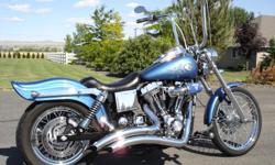 2005 Harley Davidson Wide Glide, 19k miles, chopper blue paint, Twin Cam 88 CI 1450 CC Fuel Injected motor, 5 speed transmission, Vance and Hines chrome Big Radius exhaust pipes, Wimmer chrome intake w/ chrome piston style crank breathers and matching