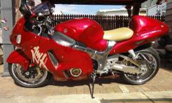 2005 UNRESTRICTED CUSTOM CANDY RED HAYABUSA. Little over 4000 miles.
It?s an absolutely stunning bike that gets compliments and attention wherever I go! It has a 300 Watt Pyle sound
system sounds very clear and loud.&nbsp; I?ve had several people tell me