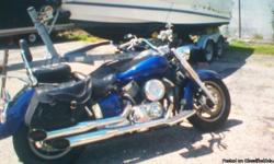 2005 yamaha 1100 v-star with 9500mi. clean bike with new cobra exhaust pipes,pillow seat,back rest with rack,leather saddlebags. bike looks and rides great.