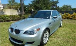 You are looking at a beautiful 2006 M5 exterior color Silverstone II Metallic and Silverstone Light Gray interior (The best Color Combination offered on the E60 M5) also includes tasteful brushed aluminum Trim along with Black Carpet, Black Dash and Black