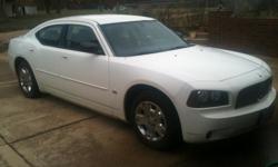 White charger high liter output with about 104,00 miles. 2 owners! Clean title. Has been mostly in a garage. Car has lots of power. 4 door sedan 5 car passenger availability. It has gray cloth interior and black carpet, needs a few repairs & it is easy to