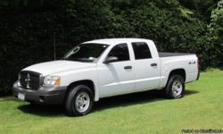 2006 Dodge Dakota Quad Cab with 4 wheel drive. Less than 10 miles on brand new tires (all 4), new battery, oil change and tonneau cover. 75k highway miles. Asking $10,750. neg. Call Davin @ ()-