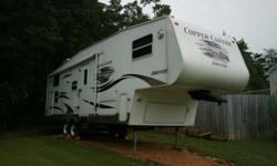 This RV 5th Wheel has :Sleeps 8 with:&nbsp;2 bunks in the rear; 1 queen bed in front&nbsp; and soaf sleeper and table folds down for a bed.It has 1 big slide;has tv in living room area and suround sound.&nbsp;It&nbsp;is very clean. Great for a