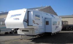 39' TOY HAULER WITH 12' SEPARATE GARAGE WITH DUAL ELECTRIC QUEEN BEDS. COULD SLEEP UP TO TEN. COMPLETELY SELF CONTAINED WITH AUTO SATELLITE, 5.5 KW ONAN GENERATOR, CENTRAL VAC, 3000 WATT INVERTER, 80 WATT SOLAR PANEL, 4 AGM 6 VOLT BATTERIES, FUEL STATION,