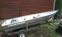 2006 V-Shaped 12' Tracker with trolling motor and trailer.
