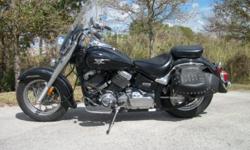 This 2006 Yamaha V-star Classic Motorcycle has 14K miles. It has a new Dunlop rear tire and removable saddle bags.The bike has no damage and does not appear to have ever been laid down. There is a passenger seat and Vance&Hines exhaust. This bike is in