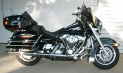 Black with blue and silver pinstripes.&nbsp; Heated grips, cruise control, radio, CB, Weatherband, CD player, driver's backrest, lots of chrome and extras.&nbsp; Great condition, ready to ride.&nbsp; Always garaged.&nbsp; 1584 cc engine.&nbsp; 27,600