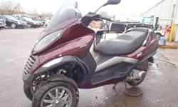FOR AUCTION ON MAY 5, 2011 at repocast.com: 2007 Piaggio MP3 Scooter, VIN# ZAPM479M775001127, 250cc Engine, Automatic Trans, 4-Stroke, Keys in Office, 5365Km, Runs, Rear trunk lid is broken, scratches, needs battery, and some cracked plastic.
For more