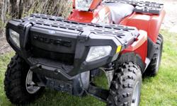 2007 Polaris Sportsman 450 4x4- Equipped with a liquid-cooled, carbureted, single-cylinder Polaris 450 engine. It features a selectable 2WD/AWD with on-demand AWD. It has a towing capacity of 1225 lb./555.7 kg and a 270 lb./122.5 kg rack capacity (90