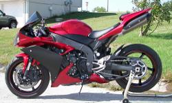 The motorcycle you are looking at is a 2007 Yamaha YZF R1 in candy red metallic!!The bike is in excellent shape and wasn't ridden very often.one owner, kept in garage, well maintained, low miles. Never raced or stunted. I have always taken exceptional