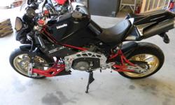 001 of 029 USA Bimota 2008 Tesi 3D LIMITED. The LTD is the carbon fiber model as opposed to the red / white painted version. I bought this from an insurance sale. It was set down ( low speed ) on the LH side. The seat body support part got scraped on the