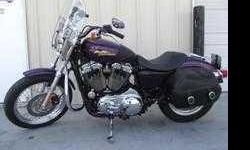Low mileage: only 4,096 miles. Well cared for, received all factory schedule maintenance.
Factory special order "Purple Haze" paint
Loads of extras:
2 seats: stock & solo
Detachable windshield
Engine Guard with helmet lock
Saddlebags
Security System