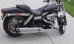 Like new Harley fat bot with extras, 7,500 miles. Excellent condition. Sounds and rides great.