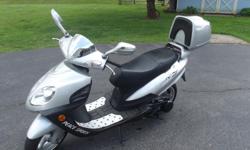 Scooter is in great condition has been garage kept and brand new battery installed, 64 original miles. Runs great, it has a 150cc motor that is clean.
