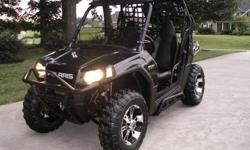 Original Polaris Black on Black body (not Painted). You will not find a nicer used RZR! No disappointments here, this one is gorgeous. You will be Impressed!