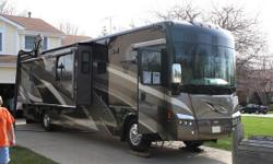 2008 Winnebago Tour with 3 slides, model 40WD and 36,175 miles. This RV is approximately 40? in length and features a Cummins 400HP diesel engine with side mounted radiator, Allison 6 speed transmission, Freightliner raised rail chassis, 2000 watt