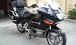 2009 BMW K1200 LT low mileage 13,744. This bike looks great and runs excellent. It has new OEM Metzeler ME880 tires on the front and back. It has:
Electronic tall windshield goes up/down with a switch and deflects the wind and bugs.
Cruise control with