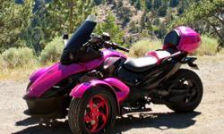 2009 Can Am Spyder RS Hot Pearl Pink and Black Cherry, the bike has a manual transmission.&nbsp; The bike has a Leo Vince exhaust, Elka Shocks, 17" front rims, Corbin rear box, outlet plug in front trunk, and other upgrades. The bike has 26,400 miles on