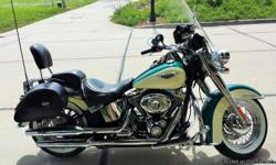 2009 HD Softail Deluxe Deep Turquoise / Antique White 29,511mi. I have keep this bike well maintained. Starts right up and runs great. Fuel injected 96' Twin Cam motor and 6 speed transmission. Quick release saddle bags, windshield and backrest sissy bar.
