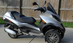 $1300 for this Piaggio three wheel scooter, Mint condition cosmetically and mechanically. Clean and clear title in hand ready to transfer. Price is firm and no trades!