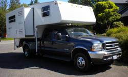 2010 Arctic Fox 990 Silver Fox Edition and 2004 Ford F-350 Super Duty Crew Cab 1-ton Dually. This is a fully self-contained 4 Season Camper that holds 55 gallons of fresh water and 14 gallons of propane. It has an onboard 2500 watt Cummins/Onan propane