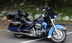 Excellent condition. In other words, very clean and scratch free. This bike has a HD Custom Paint Job known as "Chameleon", meaning that it changes as different lighting hits it from purple to blue, to black. It has HD billet Chrome skull theme throughout