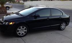 I'm selling my 2010 Honda Civic. It has 48,612 miles on it. Great on gas, automatic transmission, It is a four door, with daytime running lights, car alarm, aux port, CD player and grey cloth material. It also has a 100,000 mile warranty through Honda