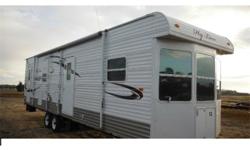 2010 Hyline Park Model Travel Trailer in great condition, has a dining and seating area, has a full kitchen appliances are in good working condition. 2 bunks bed in the rear and full size bed in the front. Price just reduced for quick sale from $13500 to