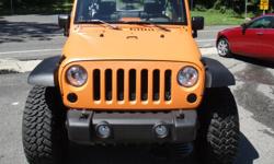 Rebuild and Custom Jeep Wrangler. Custom Paint, tires, wheels, lift, shaved bumper, blacked out lights. Please call us 631 689 8401. We will be happy to give you a detailed walk around description of any vehicle in our inventory. Our hours of operation