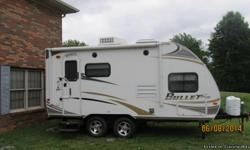 2011 Bullet Ultra Lite Travel Trailer under 20 foot long, 1 slide out, heat/air, 2 burner cookstove, refrigerator, microwave, large kitchen sink, stereo, television, queen bed with bunk bed above, sleeper sofa, bathroom with shower, outside shower, plenty