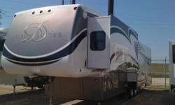 Top of the line, 40' 2011 DRV, Deluxe Mobile Suites 5th wheel. Self leveling, front end loading washer and dryer, fireplace, central vac, 2 wide screen TV's, storage,safe, stainless steel appliances, storage and more storage. No wasted space. Must see. 1