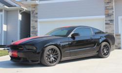 PERFECT 2011 Mustang GT with many extras. 5.0 V8 with 6 speed manual transmission. Ford Racing adjustable suspension and lowering kit . Ford Racing shocks, struts, and front/back sway bars. Shelby GT500 axle-back exhaust. RTR 19 inch wheels with Nitto