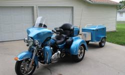 &nbsp;ON SALE IS A 2011 TRI-GLIDE AND TRAVEL TRAILER IN EXCELLENT CONDITION.
THE TRAILER IS A CUSTOM TRAILER FABRICATED FROM A 1960'S SEARS COLDSPOT REFRIGERATOR AND PAINTED TO MATCH TRI-GLIDE. THE TRI-GLIDE HAS THE FOLLOWING HD ACCESSORIES:
ADJ RIDER