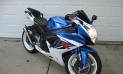 2011 Suzuki GSX-R 600 Blue with Low Miles Akrapovic Exhaust & Many Extras. This bike is in perfect condition and has been garage kept since its original purchase.&nbsp; It has just 2,704 miles.&nbsp; In addition to new pegs, levers and GSX-R gel grips, it