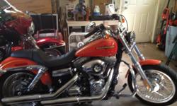 2012 Harley super glide 469 miles excellent condition has been road 5 times total color is limited edition tequila sunrise and Harley orange has a extended transferable warranty including helmet and riding gloves in with bike . Expecting a baby September