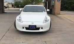 If you are looking for a fast, fun, and fresh approach at life, then this 2012 Nissan 370Z is the perfect car for you!&nbsp; This two-door sports car features an athletic design with sleek styling that is sure to turn heads.&nbsp; The pearl white paint is