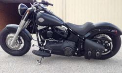2013 Harley Davidson Softail Slim, FLS 103, in their Denim Black (matte black)
Add-on's include
Mustang Seat and detachable passenger rear seat.
Passenger Pegs
Rinehart Cross Back Exhaust system-sounds amazing!!!
Roland Sands Design Black Ops Air Cleaner