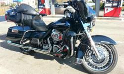Bike has over $3,000 in extras, this two tone Big Blue pearl/Vivid black with a twin cam 103, 6 speed, ABS brakes, cruise control, heated grips, factory security system, 6 gallon tank, titanium face gauges, etc. Genuine Harley Davidson accessories
