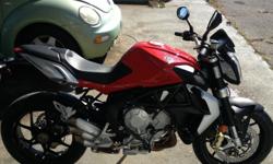 For sale is this beautiful MV Agusta Brutale. It is in like-new condition in every way. Only 39 miles on the odometer. The bike has been adult owned, garage kept, never crashed or damaged, started once a week to circulate/warm the oil, and kept on a