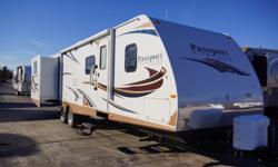 The 2014 Passport Grand Touring 3290BH is a travel trailer that has three slides with two of them found in the rear. A bunkhouse model, this RV has one rear slide with bunks over bunks on both sides. This particular model comes with Parsley interior dÃ©cor